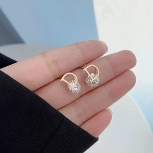Elegant rose gold D-shaped earrings with sparkling cubic zirconia in a minimalist style