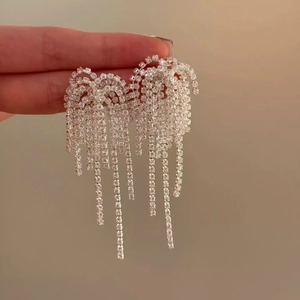 Elegant long silver tassel earrings with sparkling rhinestones in a waterfall design