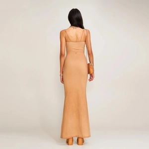 Back view of slim fit camel knitted maxi dress with adjustable straps and mermaid hemline