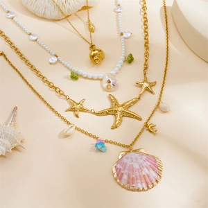 Gold-plated ocean series necklace featuring starfish, shell, and pearl charms for women