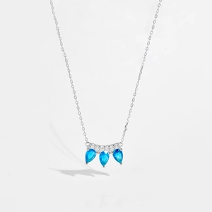 Minimalist s925 silver necklace with three teardrop blue gemstones and crown detail