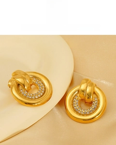 Detail of 18K vacuum plated gold round stud earrings with sparkling pavé crystals