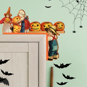 Detail of vintage Halloween wooden door corner decor with retro kids and pumpkins