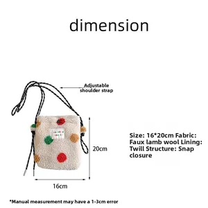 Detail of plush rainbow polka dot bag showing soft faux shearling and snap button closure
