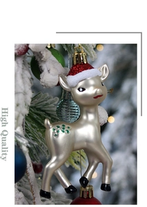 Detailed view of a pearl beige reindeer Christmas ornament with festive red glitter hat