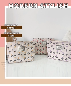 Detailed view of floral corduroy makeup bags with tulip patterns and zipper closure