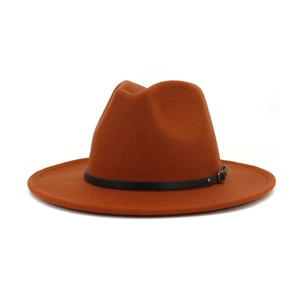 Close-up of caramel wool fedora featuring a textured surface and black leather band