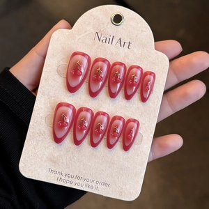 Red French gradient press-on nails with 3D cherry patterns on almond shape nails