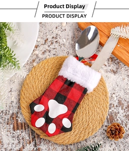 Close-up of cat paw Christmas cutlery holder in red plaid with white plush trim