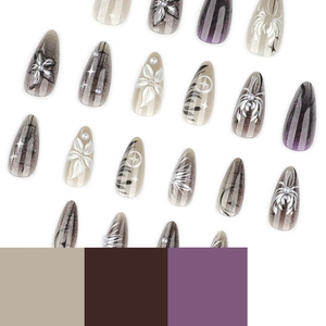Y2K black smudge press-on nails with 3D cat-eye flowers and pearl accents