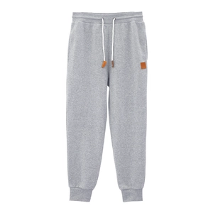 Detailed macro view of gray knitted jogger fabric texture with white cotton drawstring