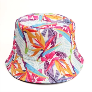 Detail of floral bucket hat featuring tropical bird of paradise patterns and fine stitching