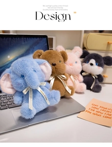 Detailed plush texture of assorted animal toys like blue elephant and brown bear dolls