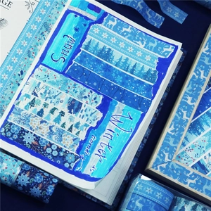 Winter themed washi tape set featuring blue snowflakes, reindeer, and pine tree patterns