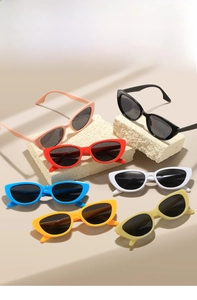 Collection of colorful cat-eye sunglasses in various vibrant shades for a stylish summer look