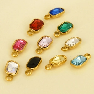 Macro shot of colorful rectangular glass crystal charms with gold stainless steel bases