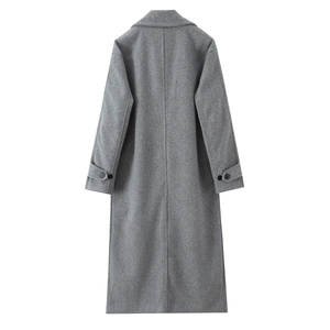 Rear view of dark grey long wool coat showing minimalist straight cut and sleeve straps