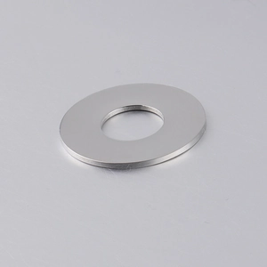 Close-up of polished stainless steel round hollow pendant with mirror finish detail