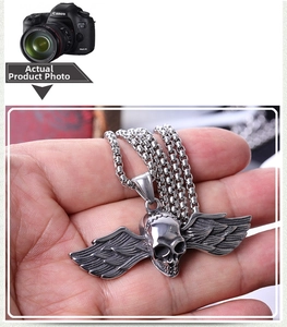 Detailed view of a gothic winged skull pendant made of retro style stainless steel