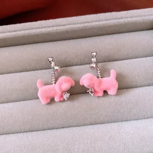 Pink flocked puppy earrings with heart zircon pendants on silver clip-on studs