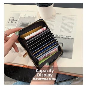 Detailed internal view of black leather accordion wallet showing multiple card slots