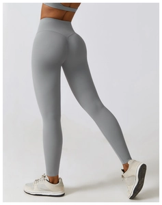 Close-up of high-waist grey yoga leggings featuring ergonomic seamless contouring and compression