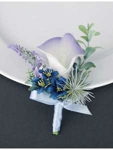 Detail of handmade lavender Calla Lily boutonniere with blue flowers and silk ribbon bow