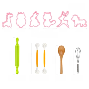 Detailed view of pink animal cookie cutters with rolling pin and baking tools for kids