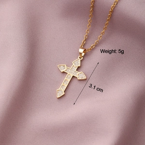 Detail of 3.1cm gold cross pendant necklace featuring pavé set sparkling zircon crystals