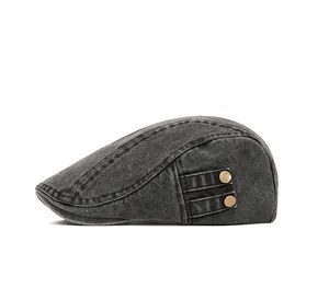 Close-up of vintage washed denim newsboy cap side with metal buttons and stitching