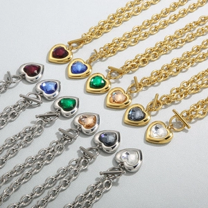 Detail of heart necklaces with colorful crystals and OT buckle in gold and silver