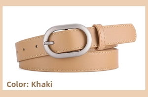 Detail of khaki PU leather belt with silver oval buckle and neat stitching on white