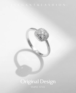 Elegant square cluster moissanite ring in S925 sterling silver on a grey background