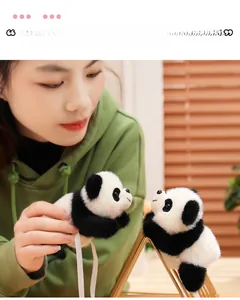 Macro detail of cute plush panda accessories with soft fur and pink blush details