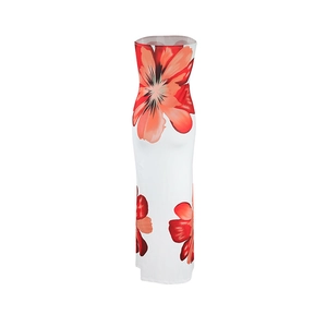Detail of white strapless maxi dress featuring vibrant red and orange floral patterns