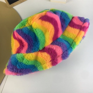 Close-up of fluffy rainbow faux fur bucket hat with soft texture and vibrant stripes