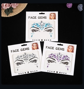 Close-up of blue, white, and purple face gems for music festival makeup and party decoration