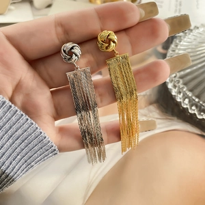 Handheld long tassel earrings featuring woven knot design in gold and silver plating