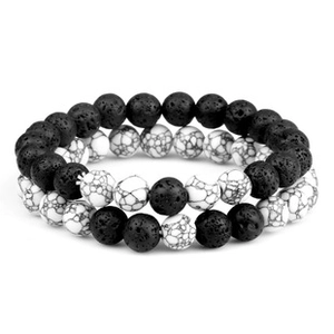 Detailed close-up of volcanic stone and marble beads on a minimalist couple bracelet set