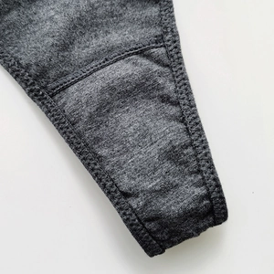 Close-up of heather grey cotton thong showing high-quality stitching and knit texture