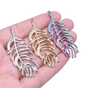 Three metal leaf pendants in silver, gold, and rainbow finishes for DIY jewelry