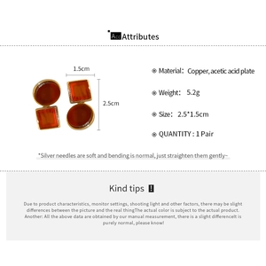 Detailed spec view of amber acetate earrings with copper frame and silver needle posts