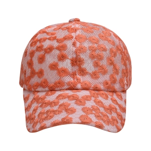 Detail of floral embroidery on orange and white lace mesh baseball cap for women
