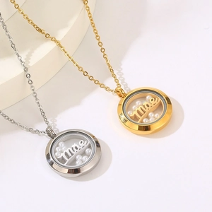 Macro view of gold and silver circle necklaces featuring pearls and engraved mae charms