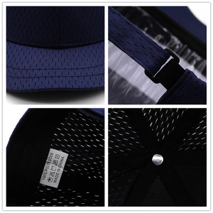 Dark blue mesh baseball cap with short brim featuring breathable polyester fabric details