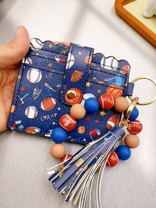 Detail of dark blue PU leather wallet keychain with sports motif and silicone beads
