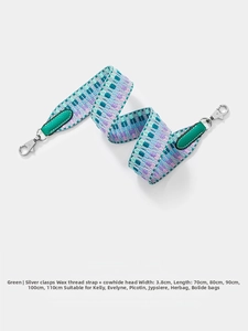 Detail of 3.8cm multi-color woven strap with green leather trim and silver metal buckle