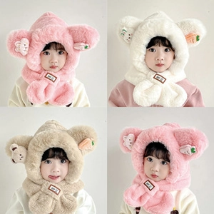 Close-up of plush children's hooded scarf with bear ears and carrot patches in soft colors