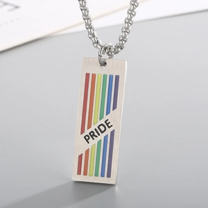 Macro detail of rainbow pride dog tag pendant with brushed stainless steel texture