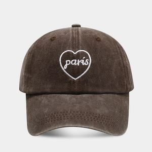 Detail of vintage brown washed cotton baseball cap with white Paris heart embroidery